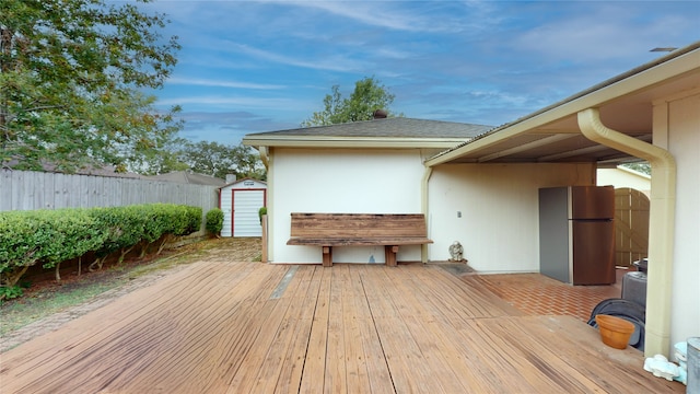 wooden deck with a shed