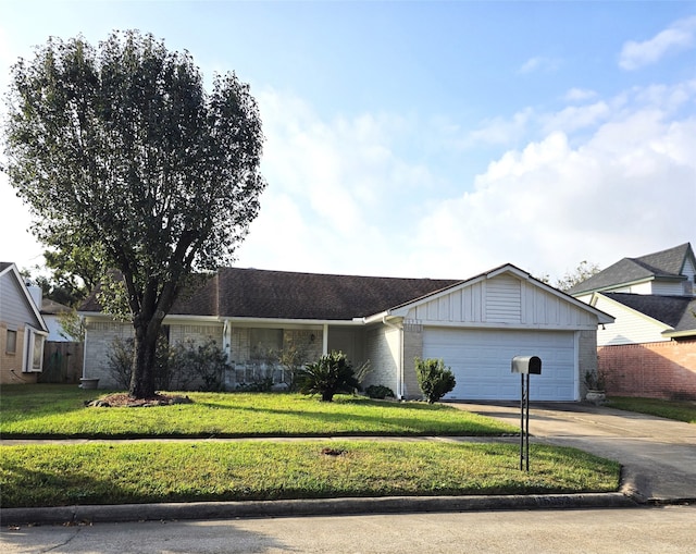 ranch-style home with a garage and a front yard