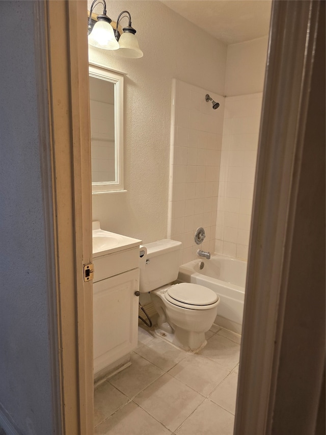 full bathroom with tile patterned flooring, vanity, toilet, and tiled shower / bath