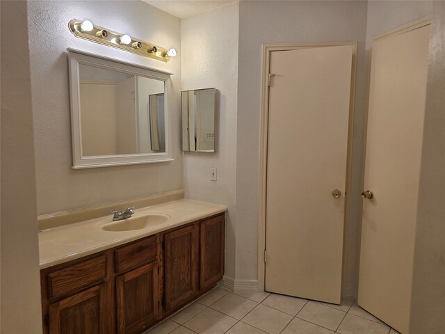 bathroom with vanity and tile patterned flooring