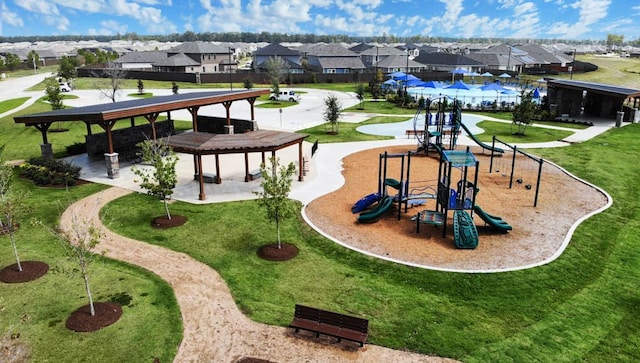 surrounding community with a playground and a lawn