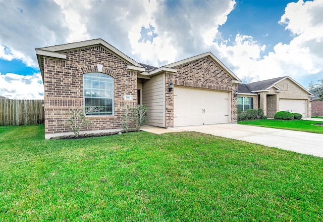 view of front of property with a garage and a front yard