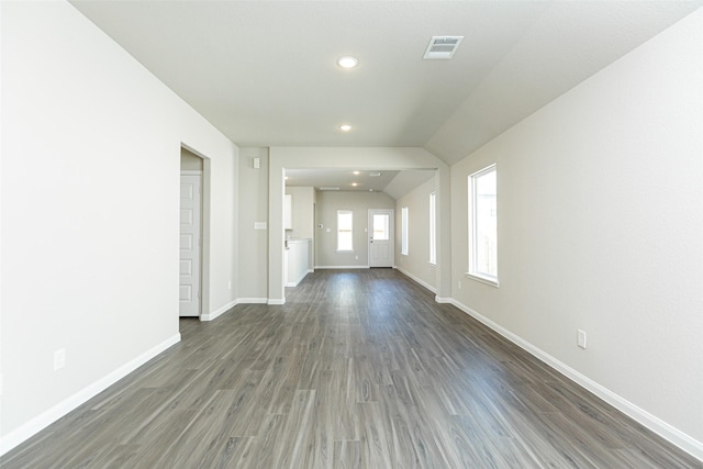 unfurnished living room with dark hardwood / wood-style flooring