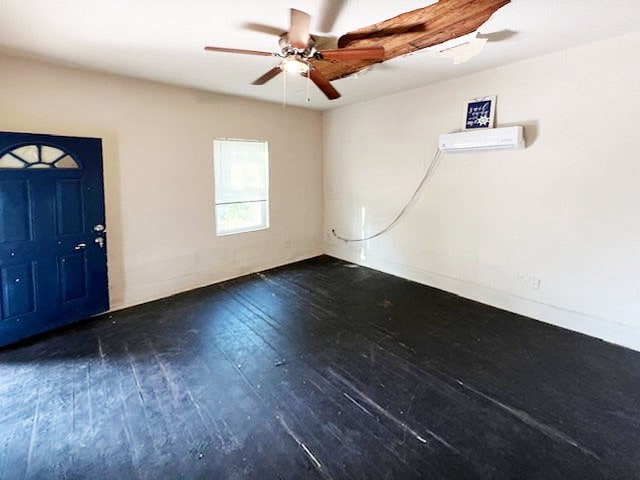 foyer with dark wood-type flooring, ceiling fan, and an AC wall unit