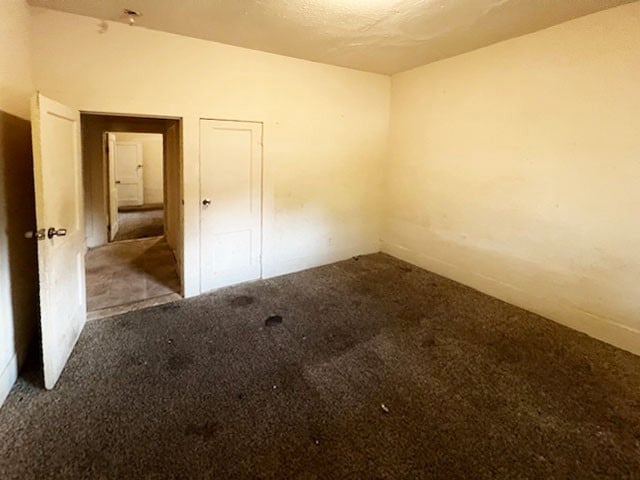 spare room featuring carpet