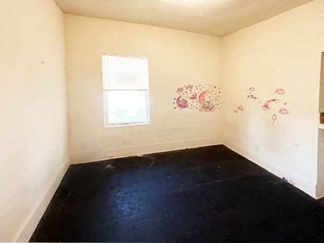 2251 Burnet St, San Antonio, TX 78202 - unfurnished room featuring baseboards and concrete flooring