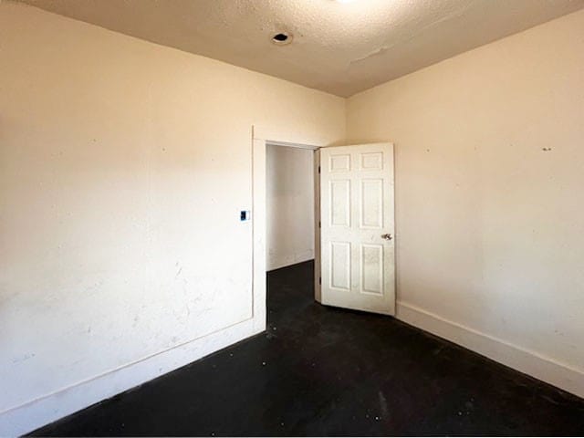 empty room with a textured ceiling