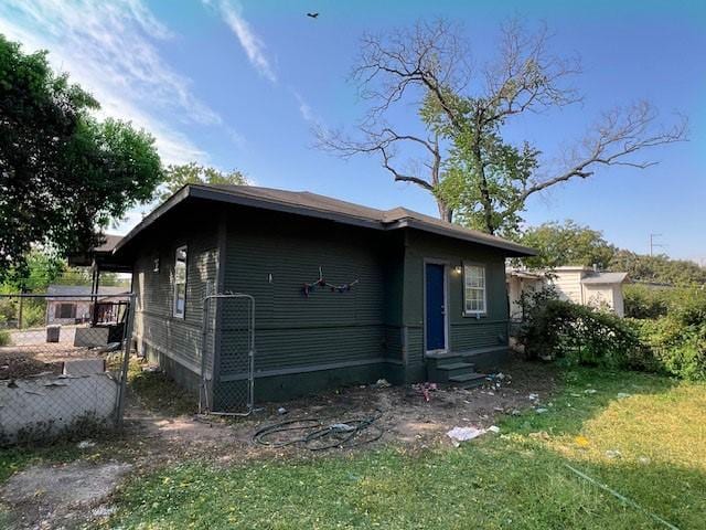 2251 Burnet St, San Antonio, TX 78202 - view of property exterior featuring entry steps and a lawn