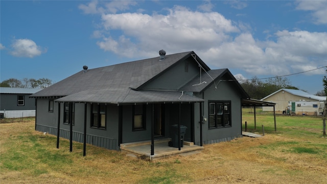 back of house with a yard