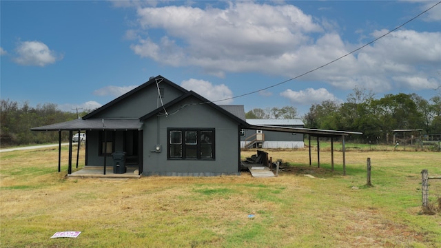 view of side of home featuring a yard