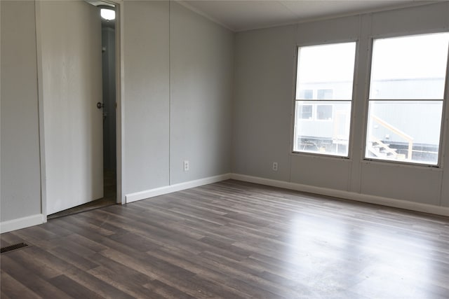 empty room with dark wood-type flooring