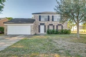 view of front of home featuring a garage and a front yard