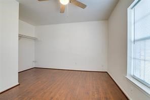 interior space with hardwood / wood-style flooring and ceiling fan