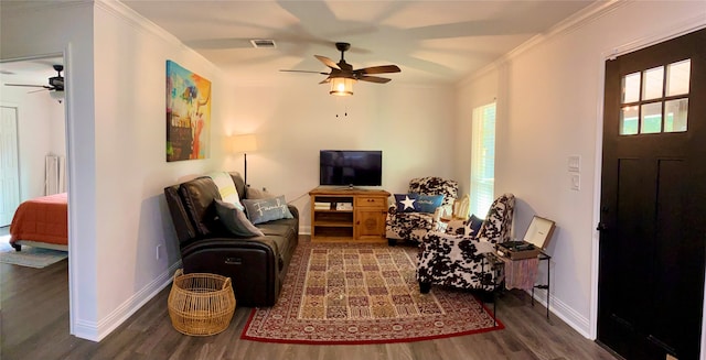 living room featuring dark hardwood / wood-style flooring, ceiling fan, and crown molding