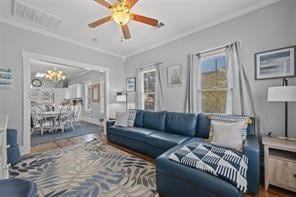 living room featuring hardwood / wood-style floors and ornamental molding