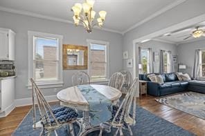 dining area featuring a wealth of natural light and dark hardwood / wood-style floors