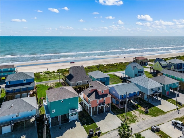 aerial view featuring a water view and a beach view