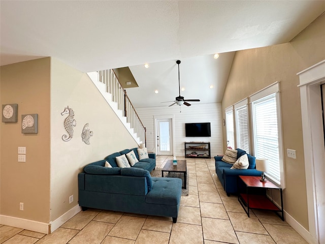 living room featuring ceiling fan and high vaulted ceiling