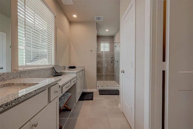 7659 Green Bulrush Way, Katy, TX 77493 - bathroom with double vanity, a stall shower, tile patterned flooring, and recessed lighting