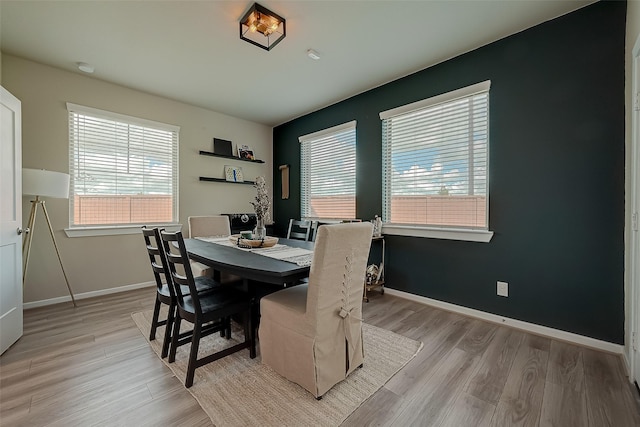 7659 Green Bulrush Way, Katy, TX 77493 - dining room featuring healthy amount of natural light, light wood-style floors, and baseboards
