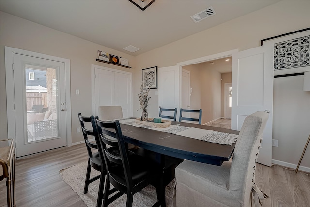 7659 Green Bulrush Way, Katy, TX 77493 - dining space with light wood-style floors and baseboards