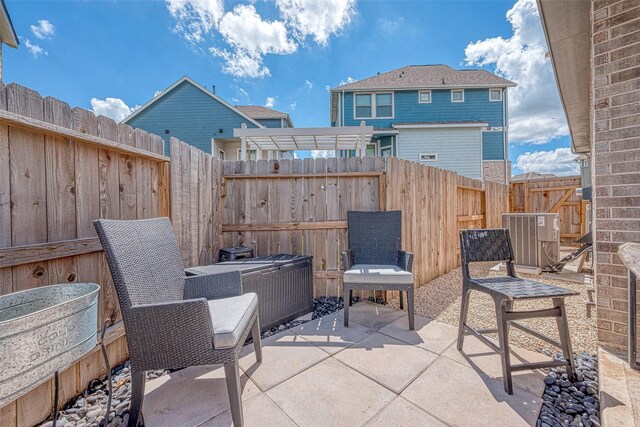 7659 Green Bulrush Way, Katy, TX 77493 - fenced backyard featuring central AC unit, a patio area, and a pergola
