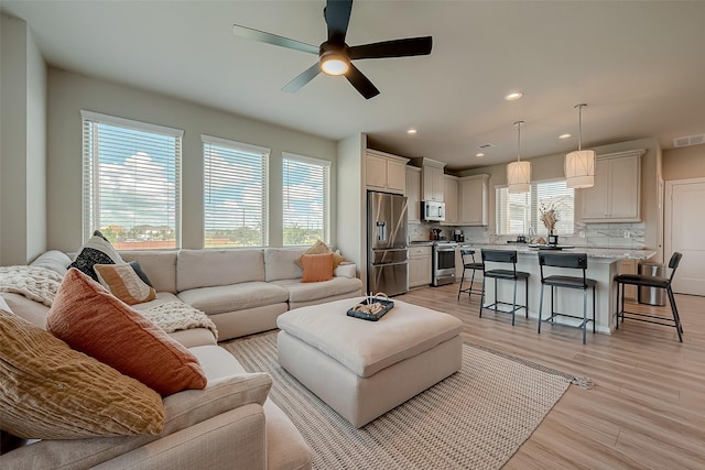 7659 Green Bulrush Way, Katy, TX 77493 - living room with ceiling fan, light wood-style floors, and recessed lighting