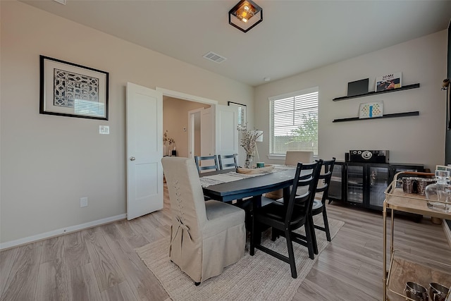 7659 Green Bulrush Way, Katy, TX 77493 - dining room with light wood-style floors and baseboards