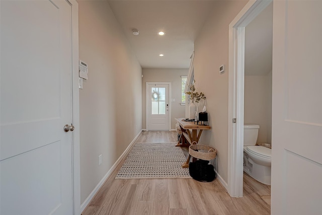 7659 Green Bulrush Way, Katy, TX 77493 - doorway to outside featuring light wood finished floors, baseboards, and recessed lighting