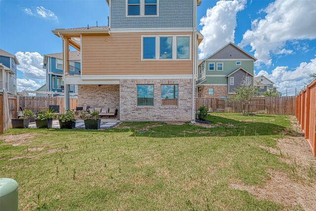 7659 Green Bulrush Way, Katy, TX 77493 - back of property featuring a patio area and brick siding