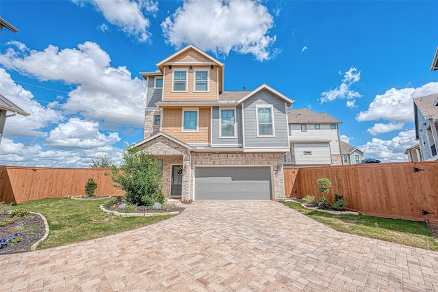 view of front facade featuring a garage and a front yard