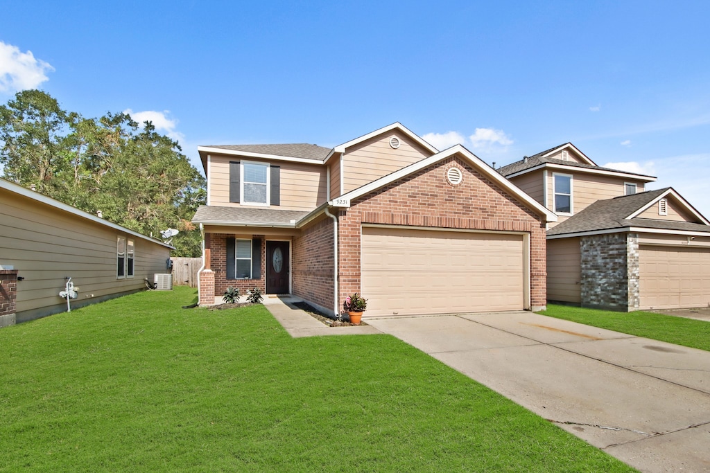 craftsman house featuring a garage, central AC, and a front lawn