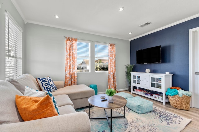 living room with ornamental molding and hardwood / wood-style floors