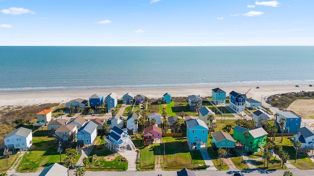 aerial view featuring a view of the beach and a water view