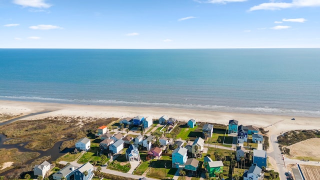 bird's eye view with a view of the beach and a water view