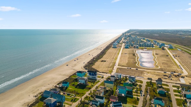 drone / aerial view featuring a view of the beach and a water view