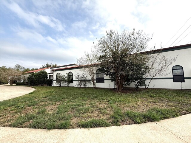 view of property exterior featuring a yard