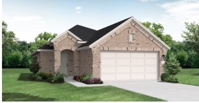 view of front of house with a front yard and a garage