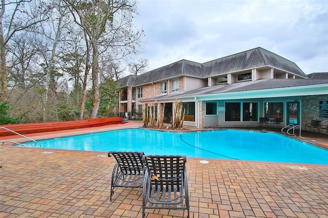 view of pool featuring a patio area