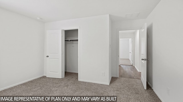 unfurnished bedroom featuring a closet and carpet floors