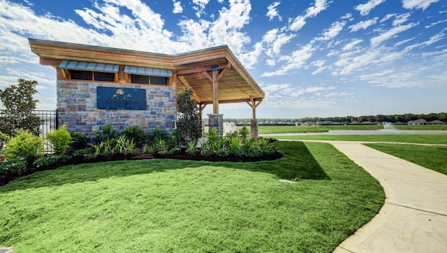 exterior space with a water view and a yard