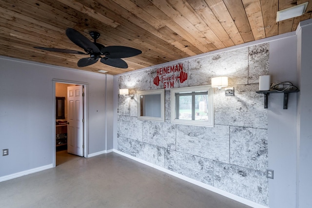 empty room featuring wood ceiling, ceiling fan, and concrete floors