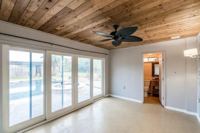 unfurnished room with ceiling fan and wood ceiling