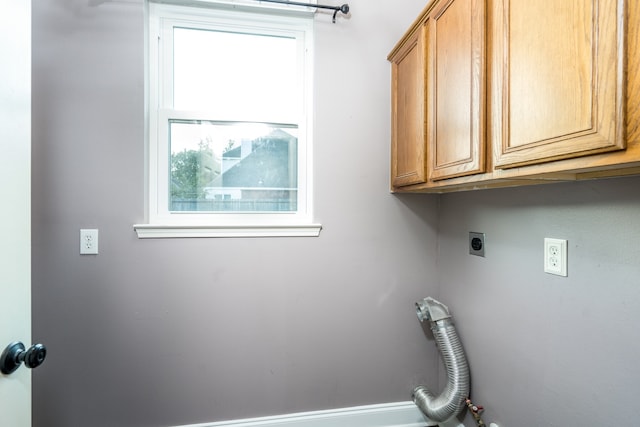 washroom featuring cabinets and hookup for an electric dryer