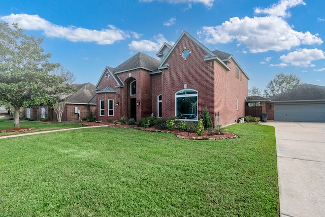 view of property with a garage and a front yard