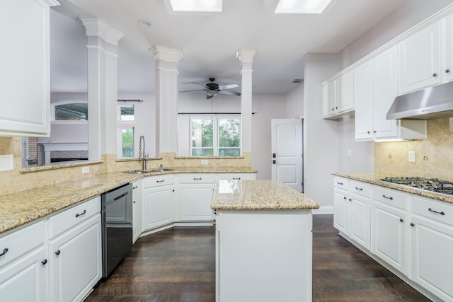 kitchen featuring white cabinets, light stone counters, appliances with stainless steel finishes, and sink