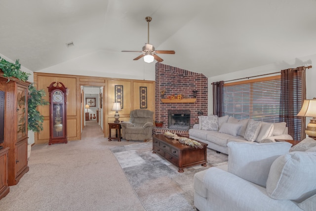 living room featuring a fireplace, light colored carpet, lofted ceiling, and ceiling fan