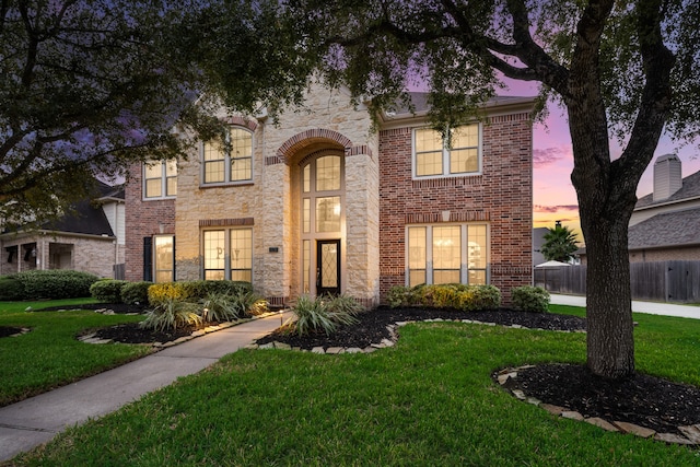 view of front of home with a lawn