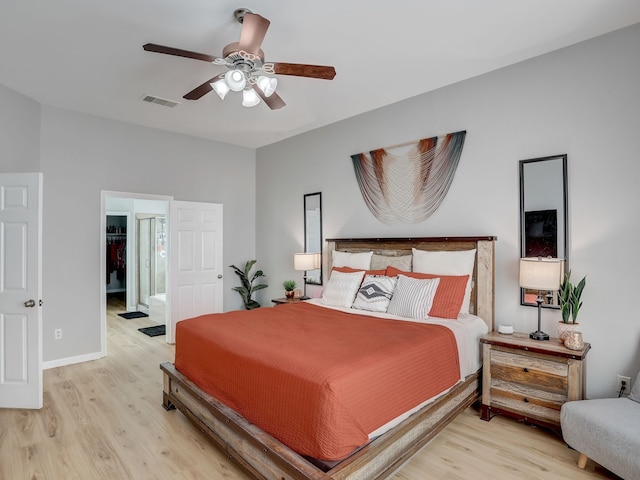 bedroom with ceiling fan and light hardwood / wood-style flooring