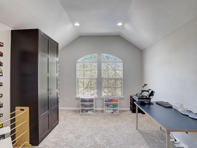 office featuring lofted ceiling and light carpet